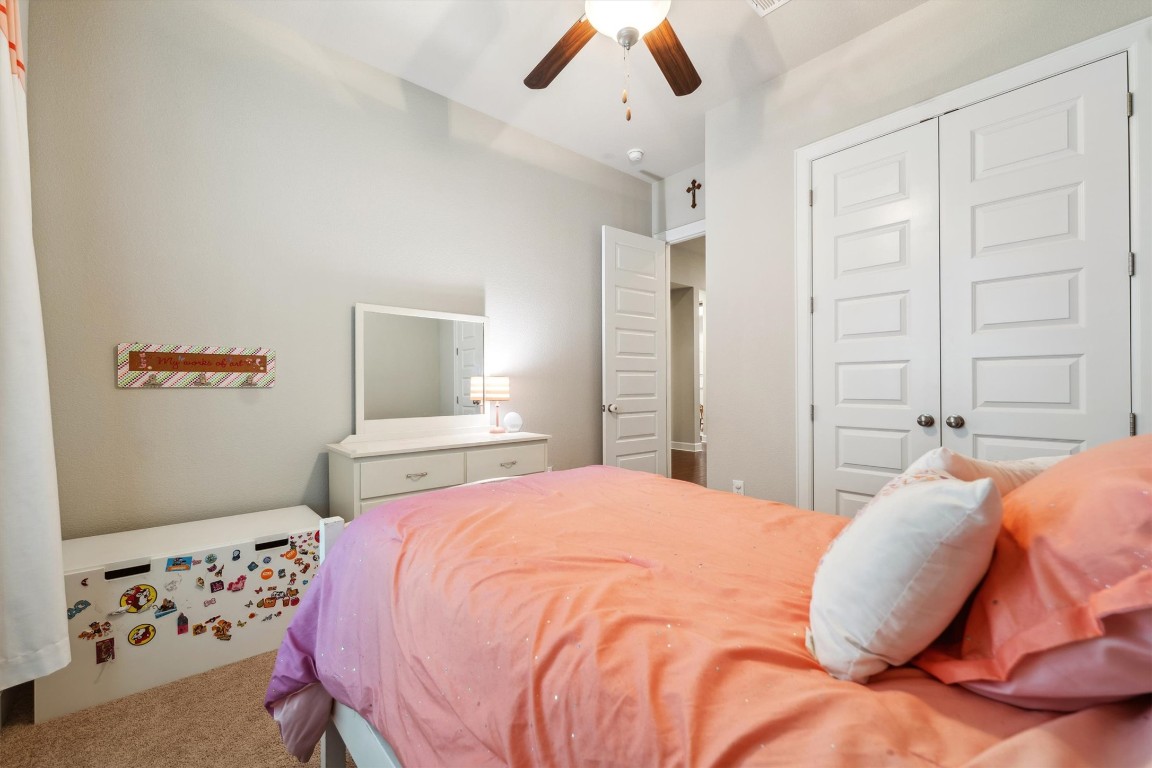 1005 Hezekiah Lane Leander, TX 78641 - Photo 29 of 36 a bedroom with a bed and a window