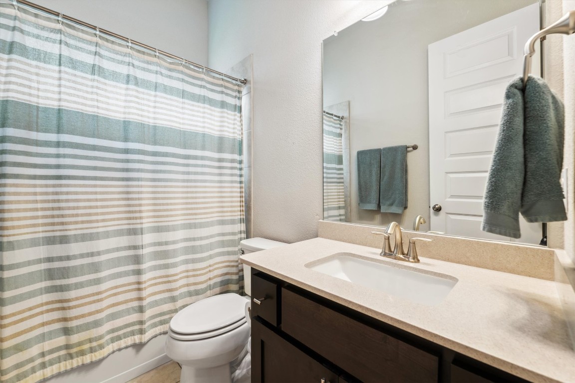 1005 Hezekiah Lane Leander, TX 78641 - Photo 30 of 36 a bathroom with a sink and a mirror