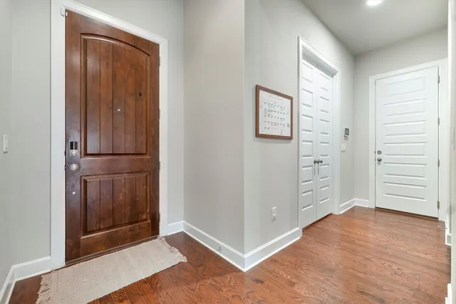 an empty room with an entryway door