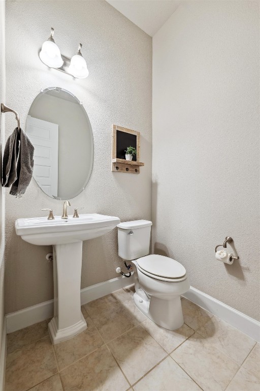 1005 Hezekiah Lane Leander, TX 78641 - Photo 6 of 36 a bathroom with a sink toilet and a mirror