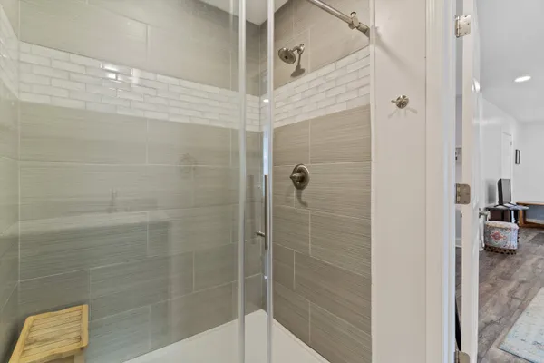 a bathroom with a shower and a sink