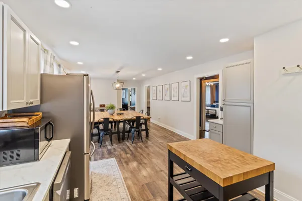 a kitchen with a table and chairs