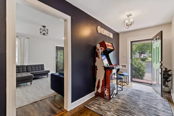 a view of a livingroom with furniture and entryway