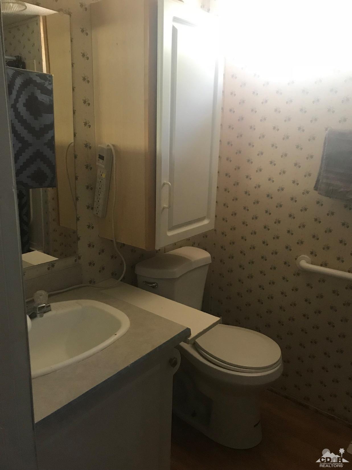 15774 Country View Road Whitewater, CA 92282 - Photo 16 of 16 a bathroom with a toilet and a shower