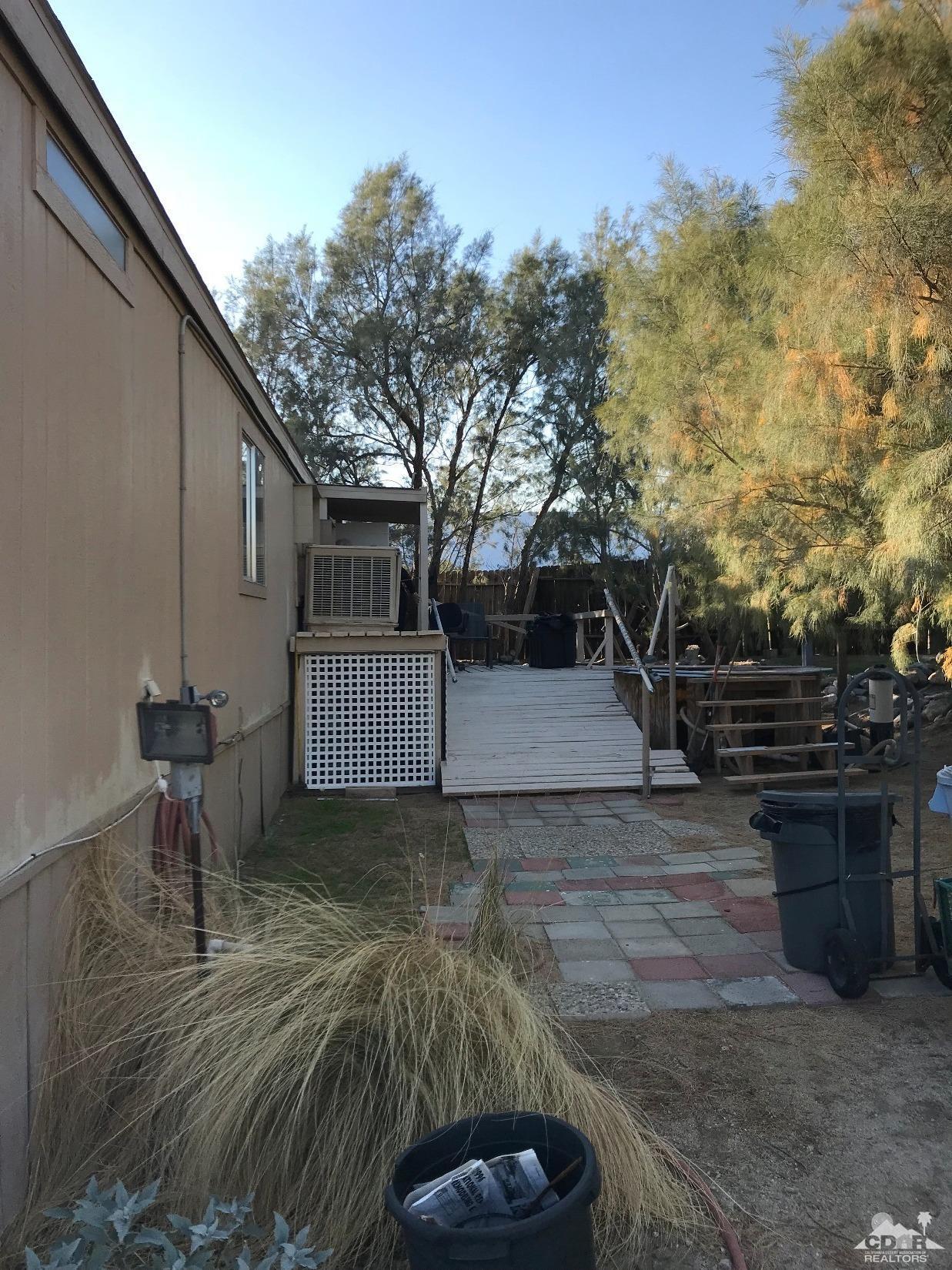 15774 Country View Road Whitewater, CA 92282 - Photo 3 of 16 a view of a backyard with sitting area