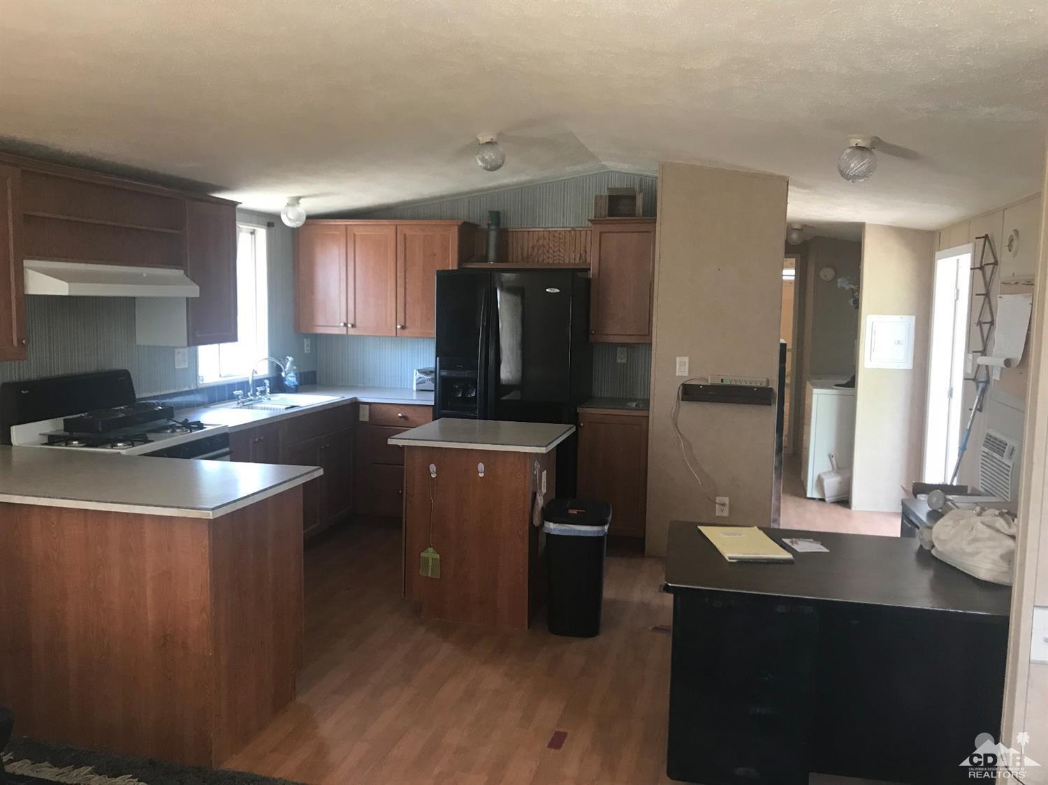15774 Country View Road Whitewater, CA 92282 - Photo 6 of 16 a kitchen with a sink stove and refrigerator