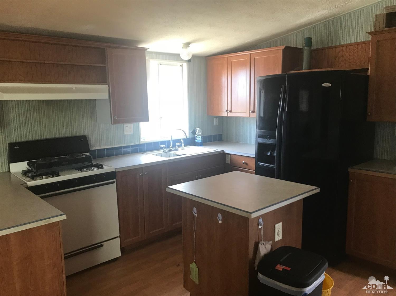 15774 Country View Road Whitewater, CA 92282 - Photo 7 of 16 a kitchen with sink a refrigerator and a stove