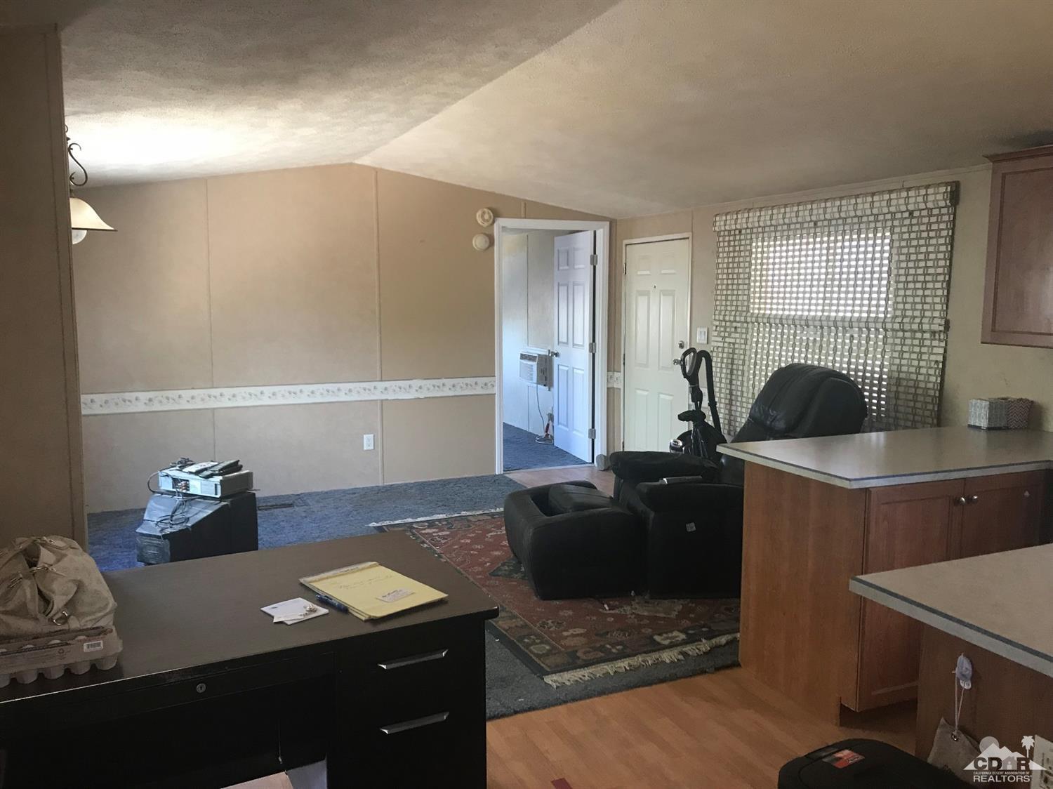 15774 Country View Road Whitewater, CA 92282 - Photo 8 of 16 a living room with furniture and a window
