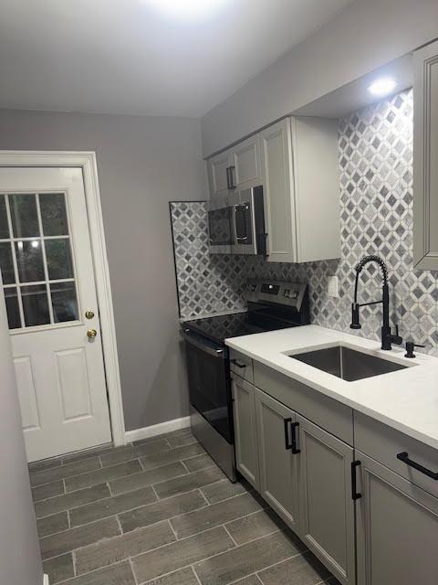 a kitchen with a sink and cabinets