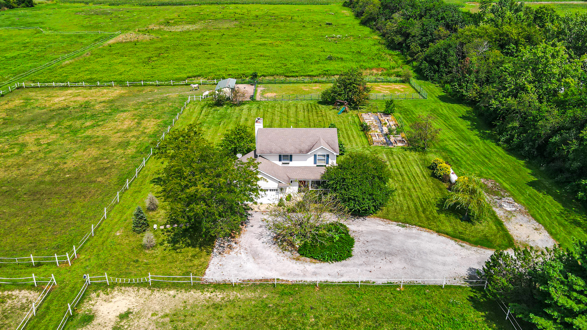 350 East Munz Road Crete, IL 60417 - Photo 1 of 34 an aerial view of residential houses with outdoor space and trees