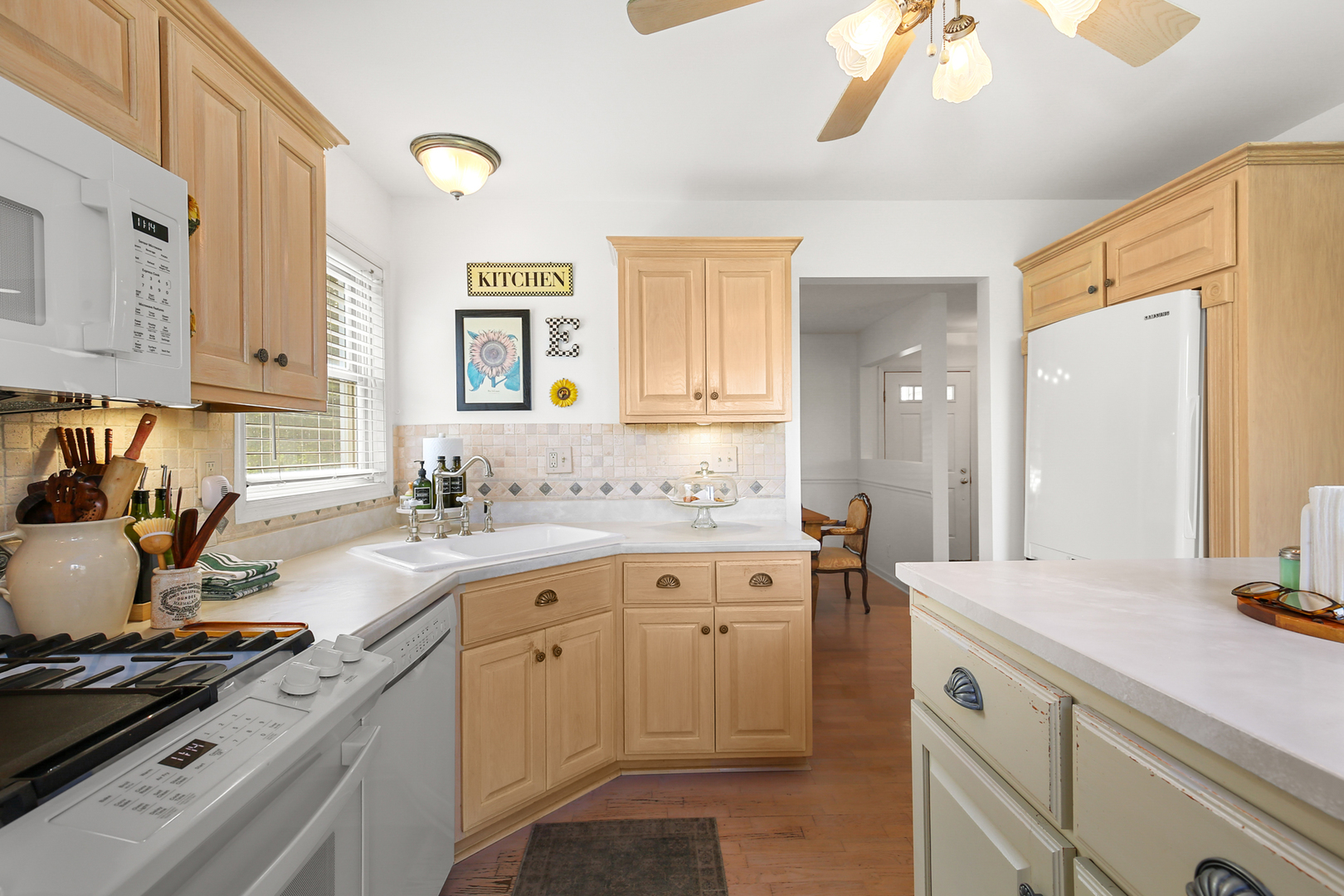 350 East Munz Road Crete, IL 60417 - Photo 11 of 34 a kitchen with a sink stove and cabinets