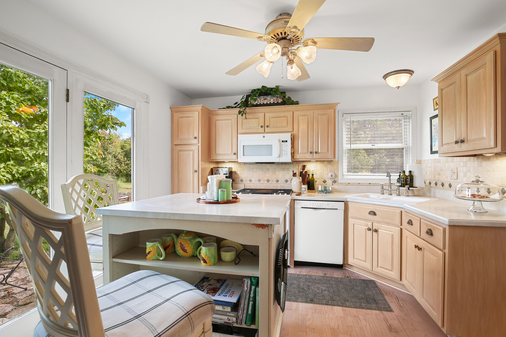 350 East Munz Road Crete, IL 60417 - Photo 12 of 34 a kitchen with a table chairs sink and cabinets