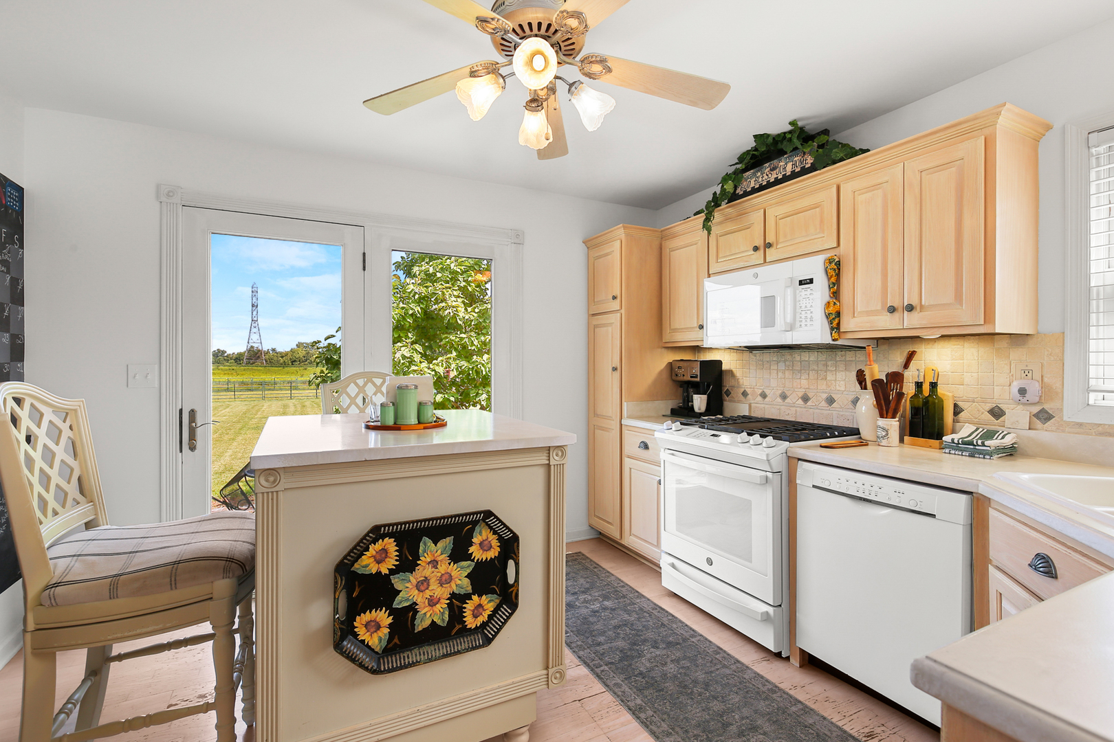 350 East Munz Road Crete, IL 60417 - Photo 13 of 34 a kitchen with stainless steel appliances granite countertop a stove a sink and a refrigerator