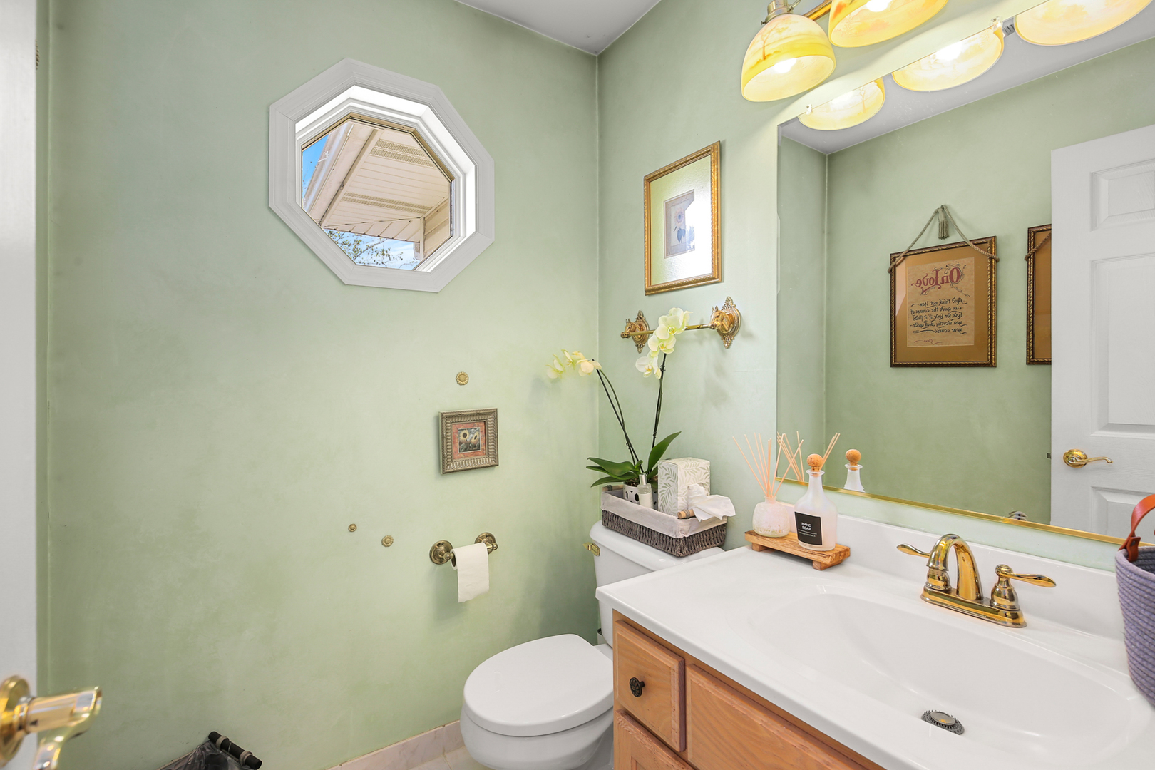 350 East Munz Road Crete, IL 60417 - Photo 15 of 34 a bathroom with a sink vanity mirror and toilet