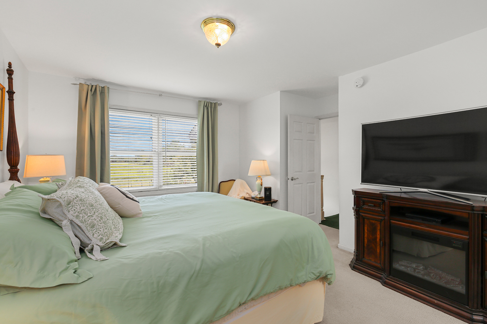 350 East Munz Road Crete, IL 60417 - Photo 17 of 34 a bedroom with a bed and a television