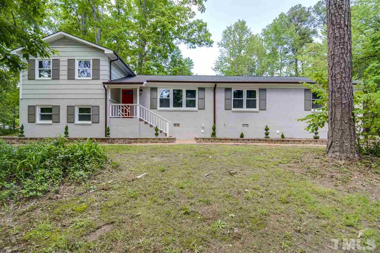 131 Lin Tilley Road Durham, NC 27712 - Photo 1 of 25 a front view of a house with garden