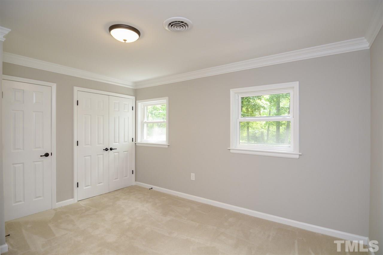 131 Lin Tilley Road Durham, NC 27712 - Photo 15 of 25 an empty room with windows