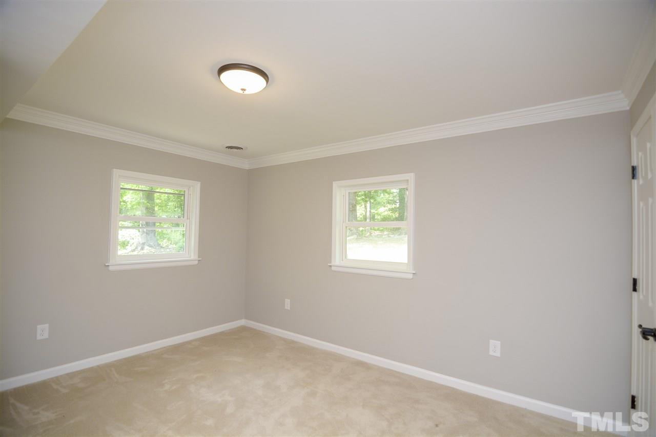 131 Lin Tilley Road Durham, NC 27712 - Photo 17 of 25 an empty room with a window
