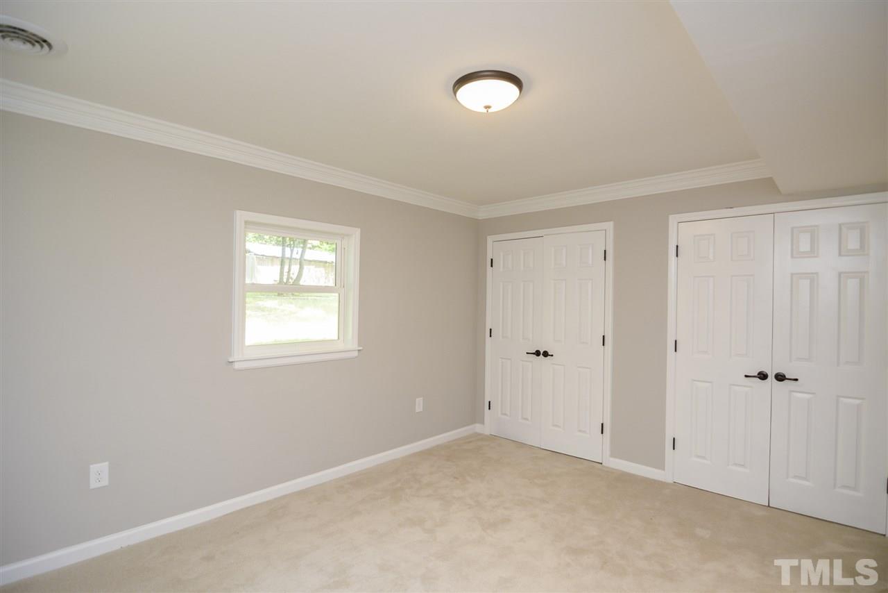 131 Lin Tilley Road Durham, NC 27712 - Photo 18 of 25 an empty room with windows