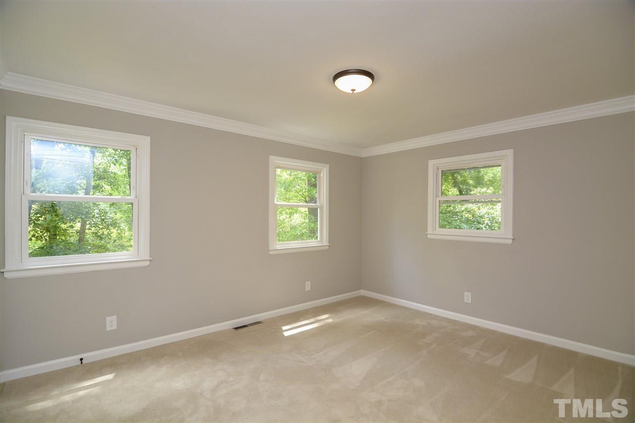 131 Lin Tilley Road Durham, NC 27712 - Photo 21 of 25 an empty room with windows