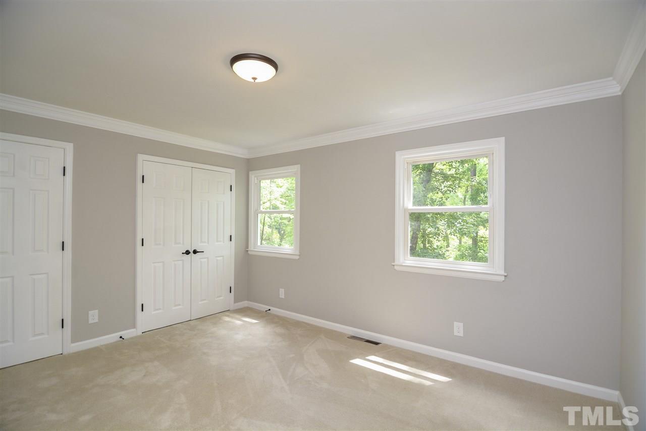 131 Lin Tilley Road Durham, NC 27712 - Photo 22 of 25 a view of an empty room with a window