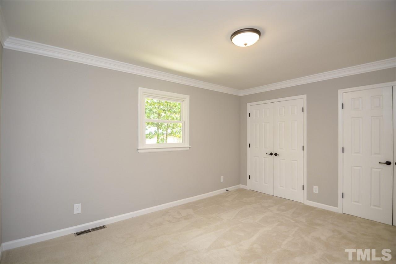 131 Lin Tilley Road Durham, NC 27712 - Photo 25 of 25 a view of an empty room with a window and closet area