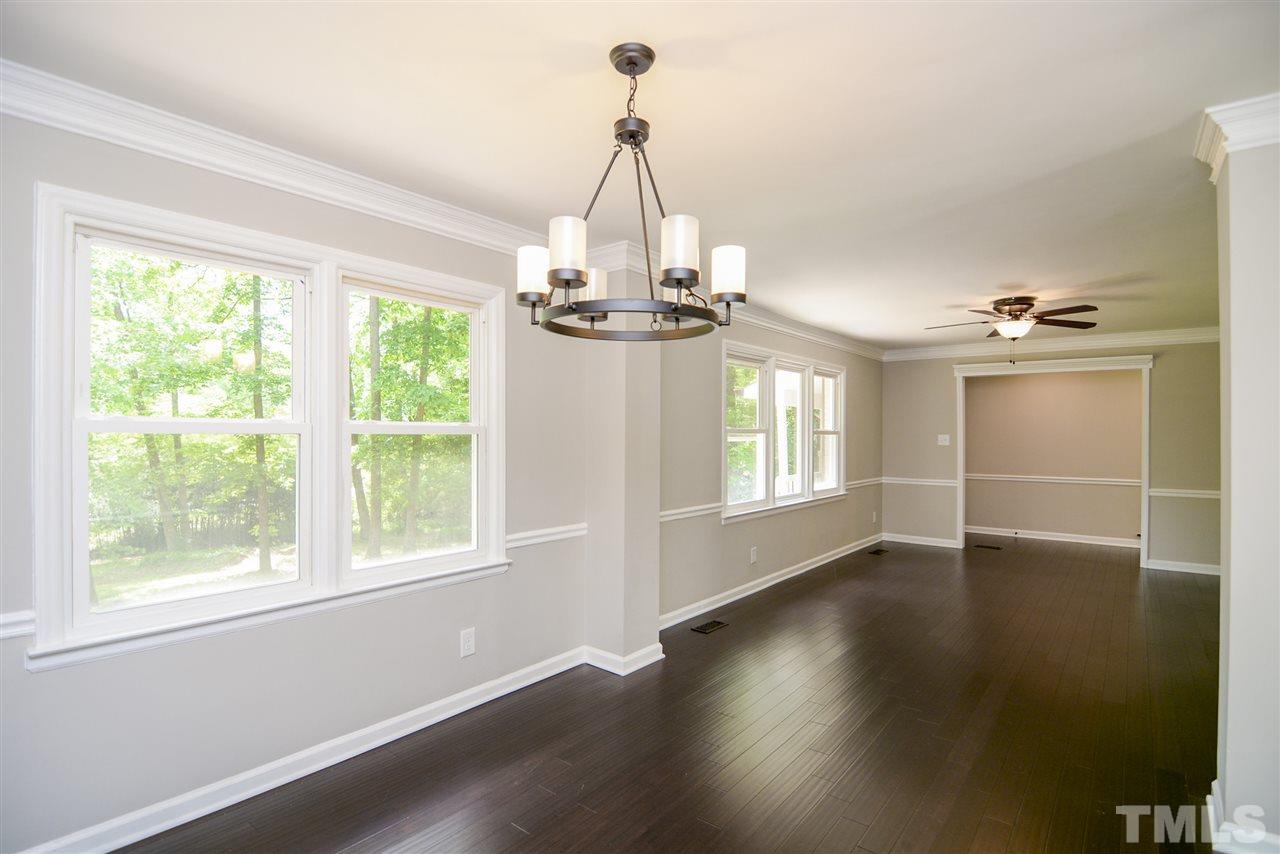 131 Lin Tilley Road Durham, NC 27712 - Photo 8 of 25 a view of a livingroom with wooden floor and a window