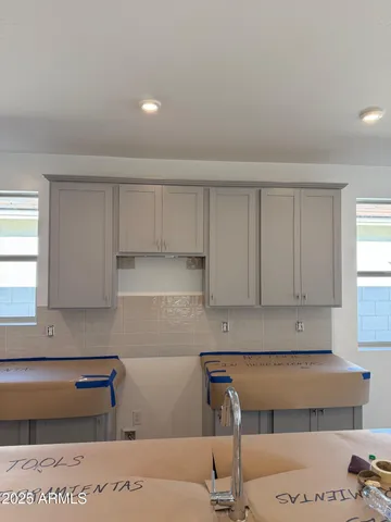 a kitchen with a sink and cabinets