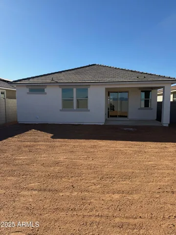 a house view with a backyard space