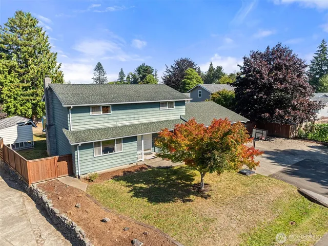 front view of a house with a yard
