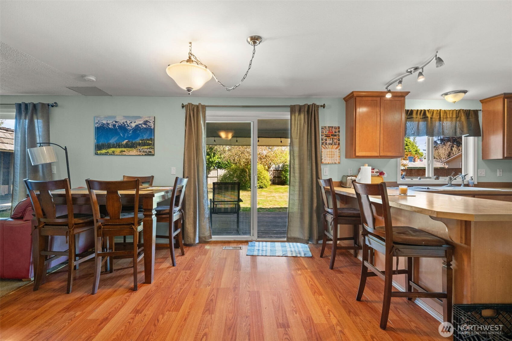 1420 Dundee Drive Cosmopolis, WA 98537 - Photo 13 of 40 a view of a dining room with furniture and wooden floor