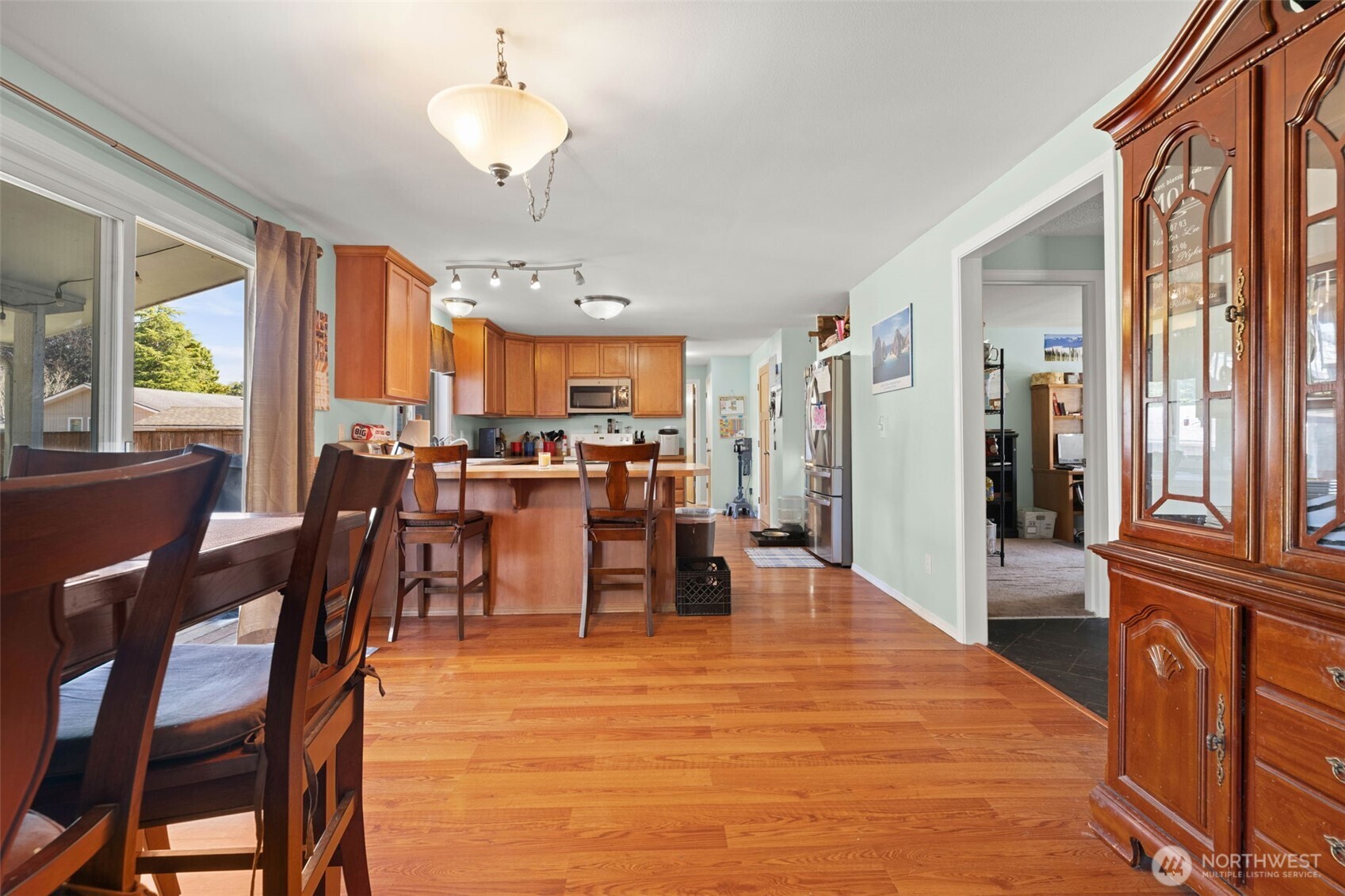 1420 Dundee Drive Cosmopolis, WA 98537 - Photo 18 of 40 a dining room with furniture a chandelier and wooden floor