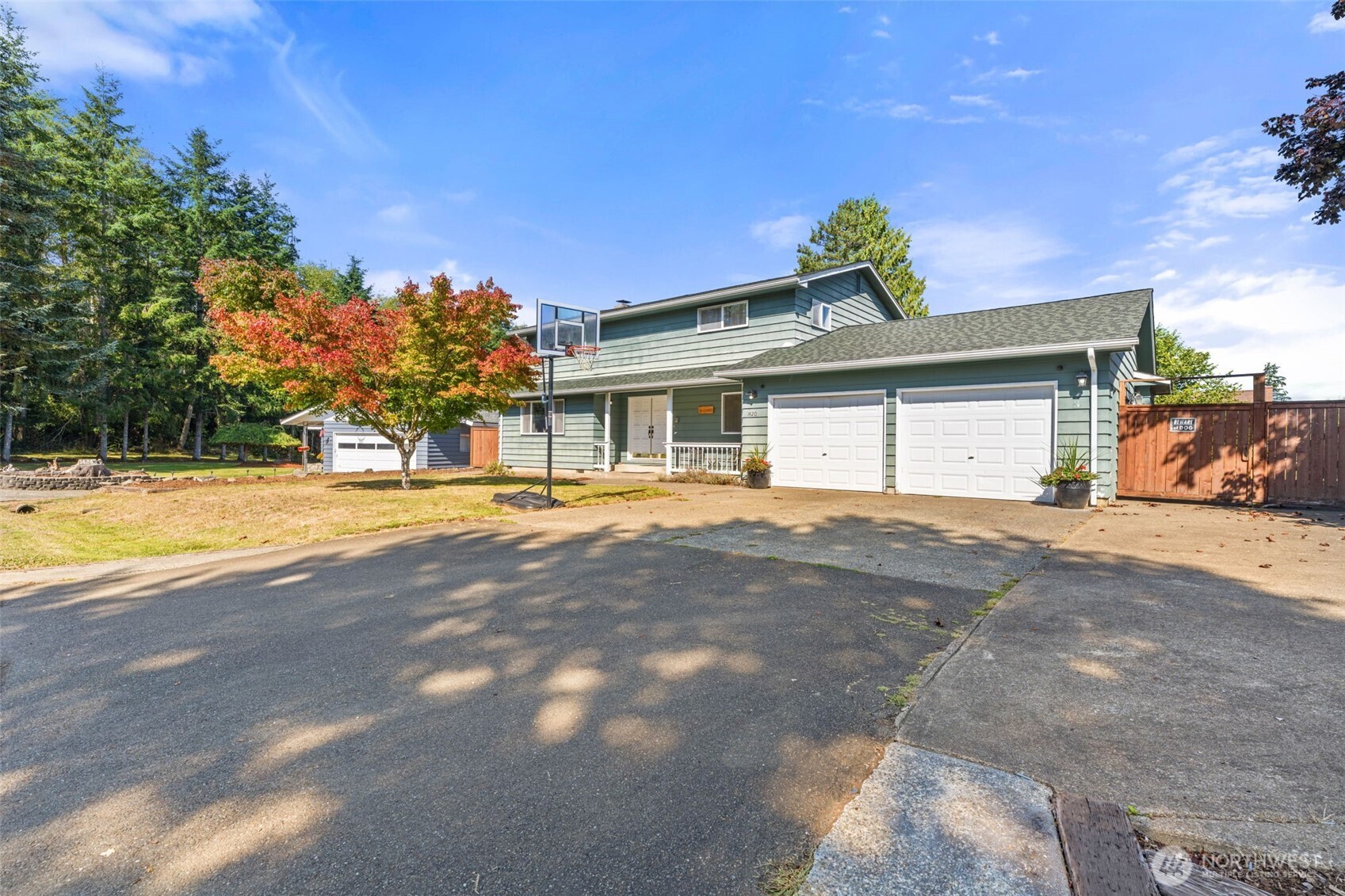 1420 Dundee Drive Cosmopolis, WA 98537 - Photo 34 of 40 a front view of a house with a yard and a garage