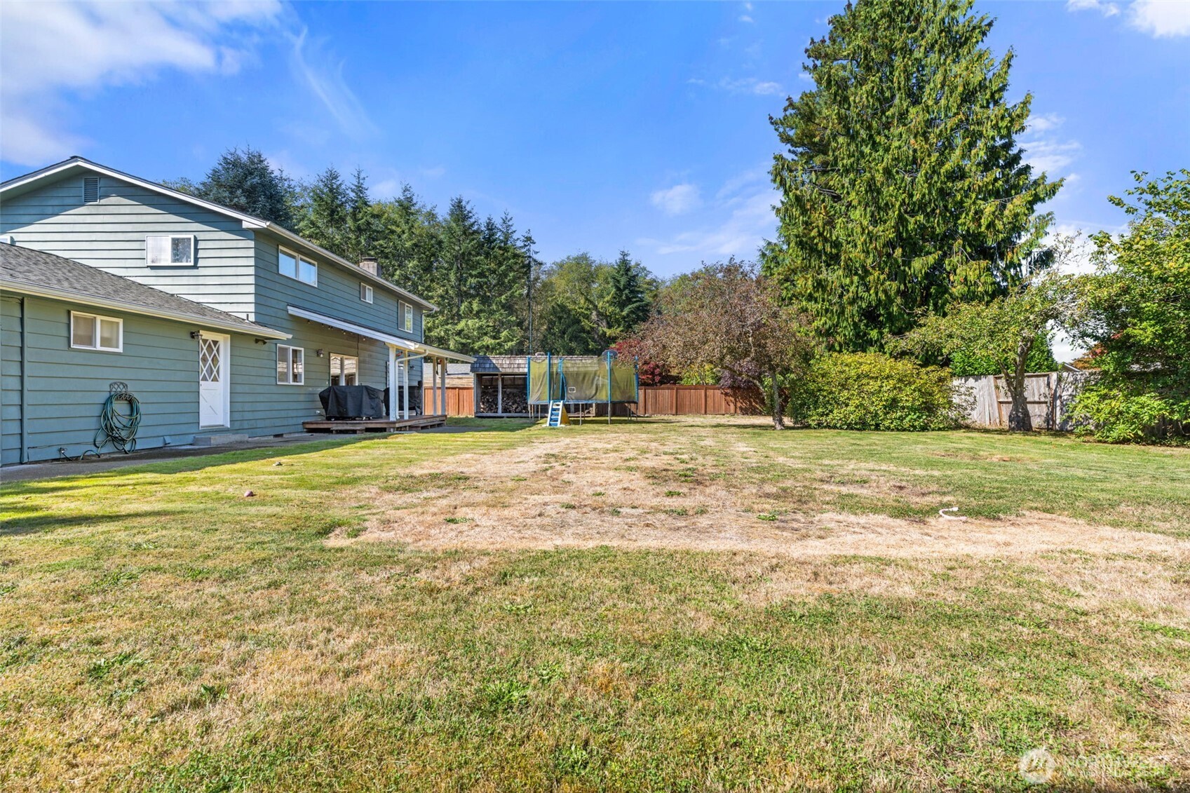 1420 Dundee Drive Cosmopolis, WA 98537 - Photo 35 of 40 a house view with swimming pool in front of it