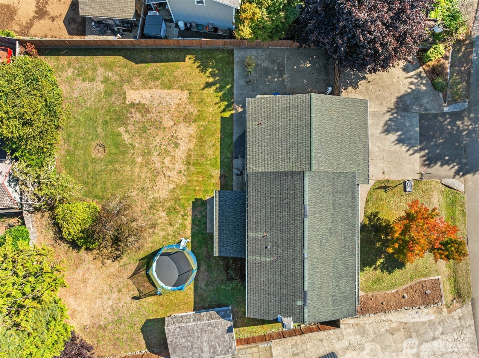 1420 Dundee Drive Cosmopolis, WA 98537 - Photo 39 of 40 a brick house with a blue wall in front of it
