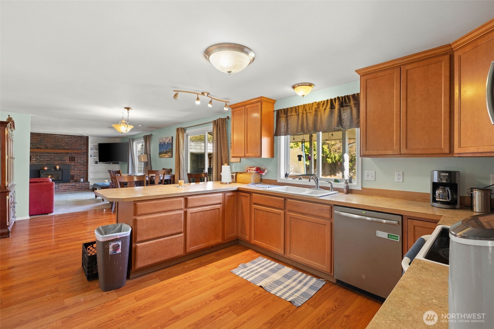 1420 Dundee Drive Cosmopolis, WA 98537 - Photo 9 of 40 a large kitchen with stainless steel appliances granite countertop a sink and cabinets