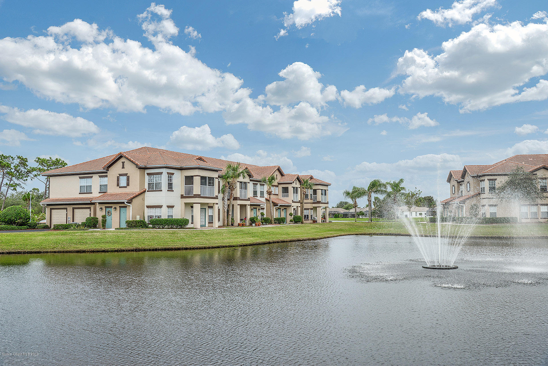 3151 Conservation Place Melbourne, FL 32934 - Photo 3 of 10 a view of a city with a building in the background