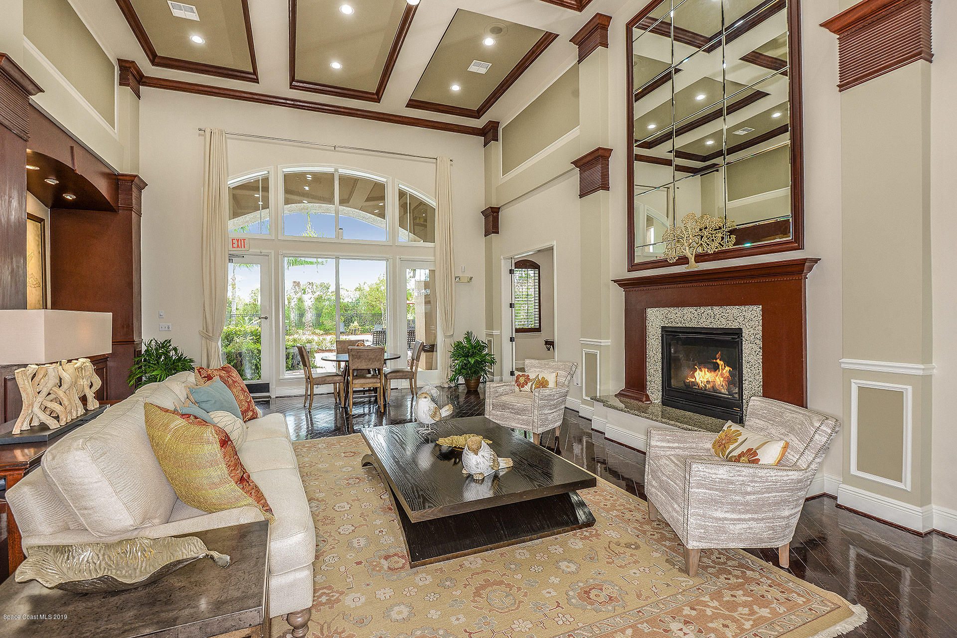 3151 Conservation Place Melbourne, FL 32934 - Photo 5 of 10 a living room with furniture fireplace and a large window