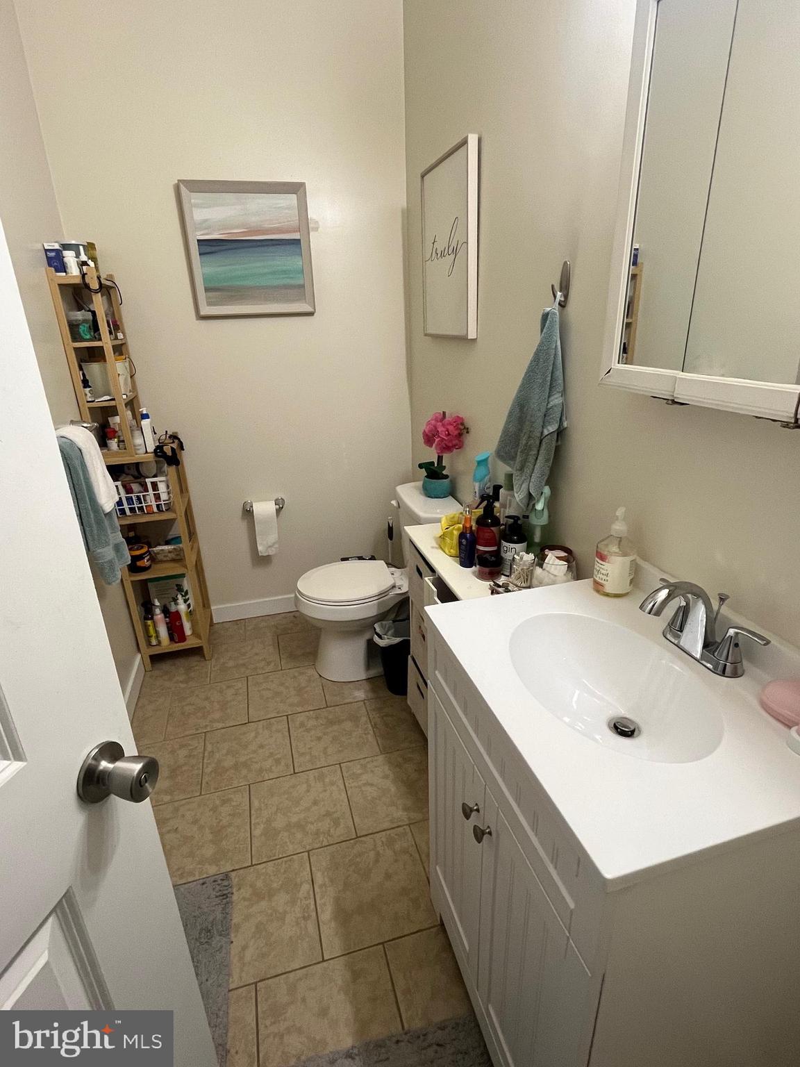 4010 Baring Street Philadelphia, PA 19104 - Photo 15 of 22 a bathroom with a sink mirror and toilet