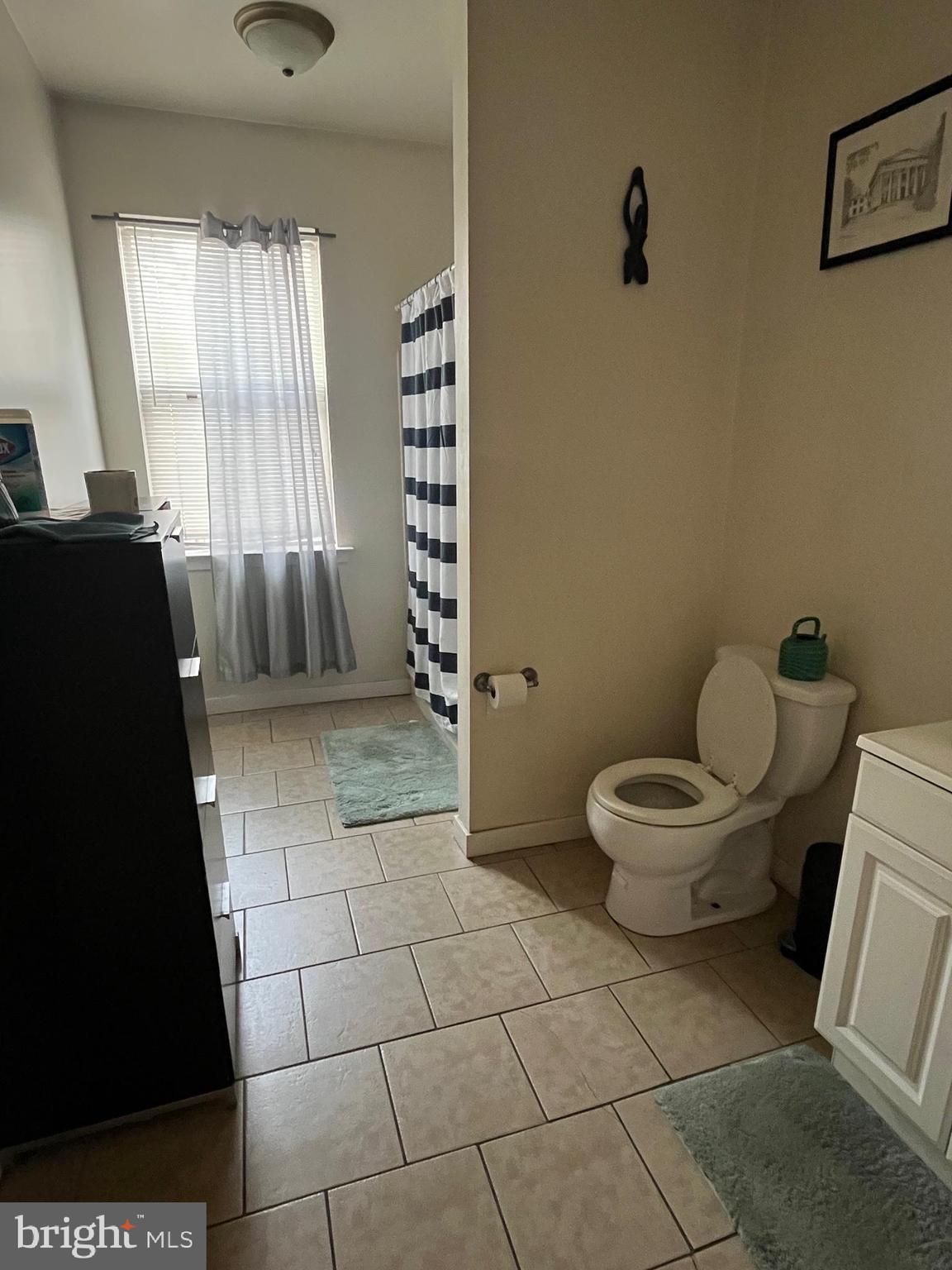 4010 Baring Street Philadelphia, PA 19104 - Photo 10 of 22 a bathroom with a toilet and a shower
