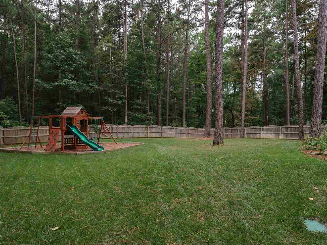4844 Inwood Road Raleigh, NC 27603 - Photo 21 of 25 This wonderful home is nestled on .95 acres and has a fenced back yard. There is lots of space to run and play and enjoy the great outdoors here. Back Yard