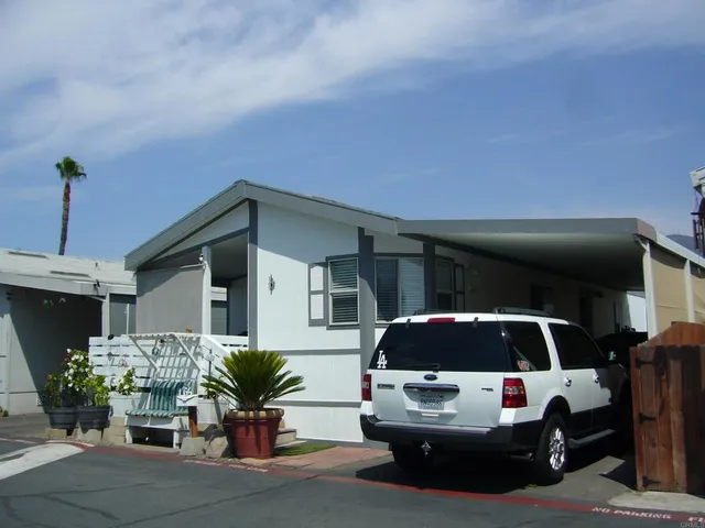 a potted plant sitting in front of a house