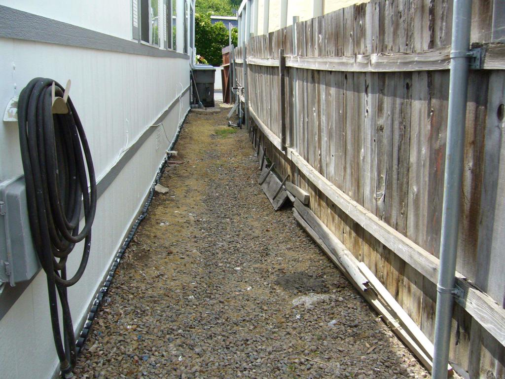 9902 Jamacha Boulevard, Unit SPACE #165 Spring Valley, CA 91977 - Photo 22 of 25 a view of balcony with wooden floor and stairs