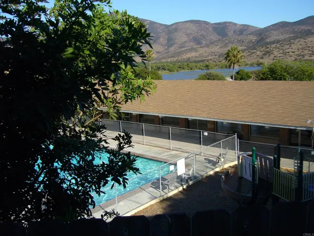 a view of a swimming pool with a terrace