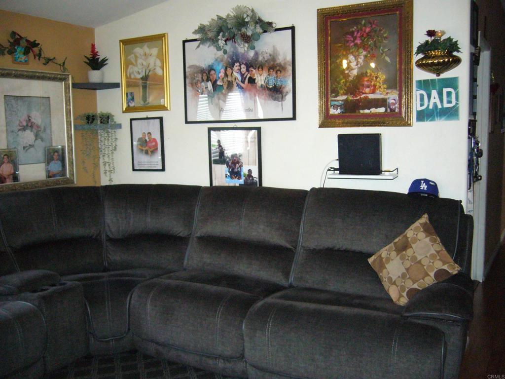 9902 Jamacha Boulevard, Unit SPACE #165 Spring Valley, CA 91977 - Photo 4 of 25 a living room with furniture and painting on the wall