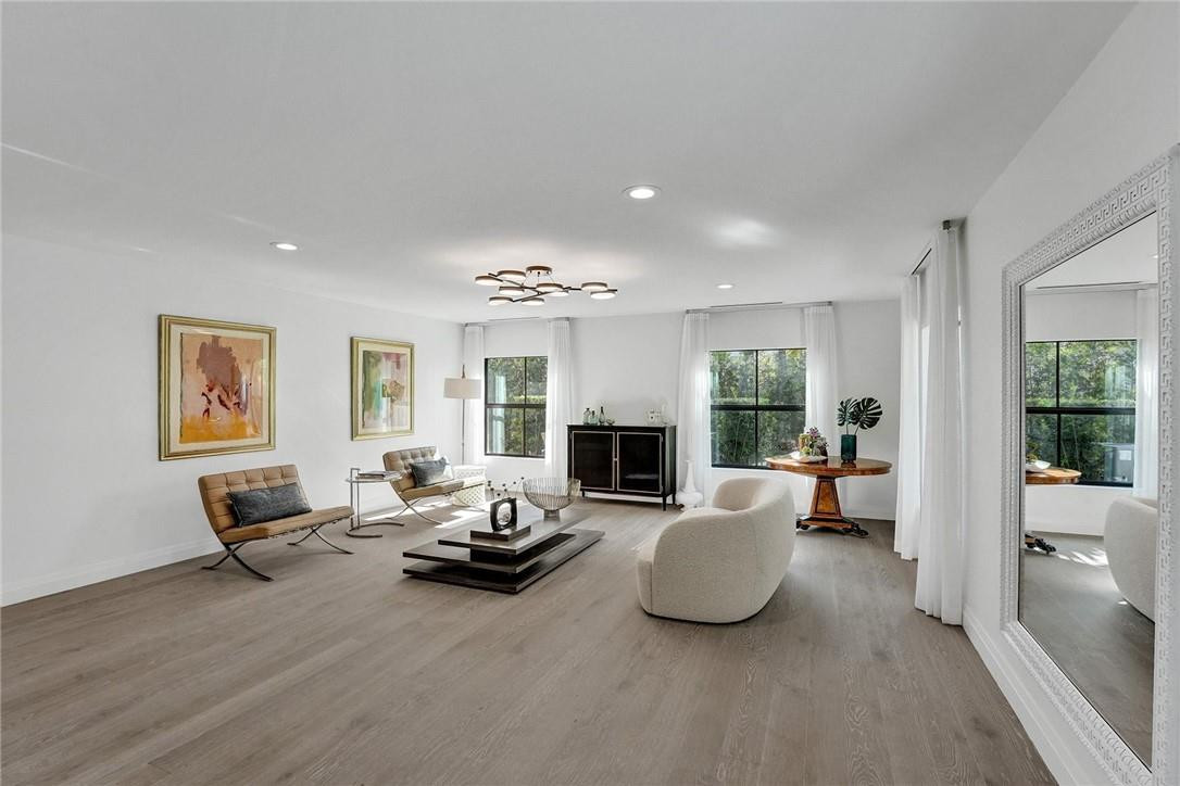 9 Tahoe Lane Sea Ranch Lakes, FL 33308 - Photo 12 of 54 a living room with furniture and a fireplace