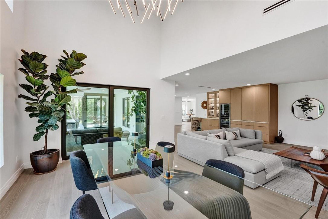 9 Tahoe Lane Sea Ranch Lakes, FL 33308 - Photo 19 of 54 a living room with furniture a potted plant and a large window