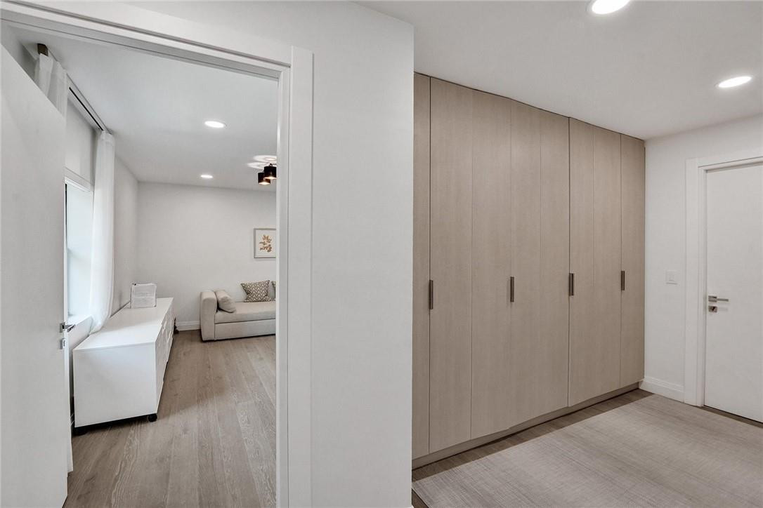 9 Tahoe Lane Sea Ranch Lakes, FL 33308 - Photo 22 of 54 a view of a hallway to a livingroom and a couch