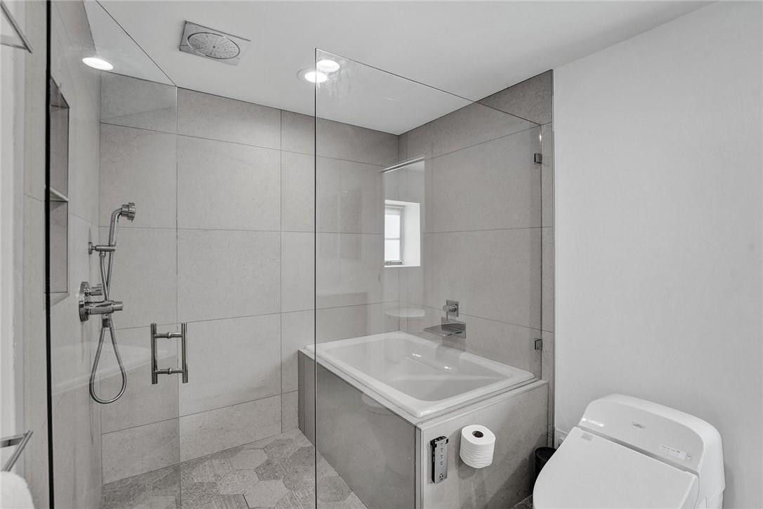 9 Tahoe Lane Sea Ranch Lakes, FL 33308 - Photo 33 of 54 a bathroom with a sink a toilet and shower