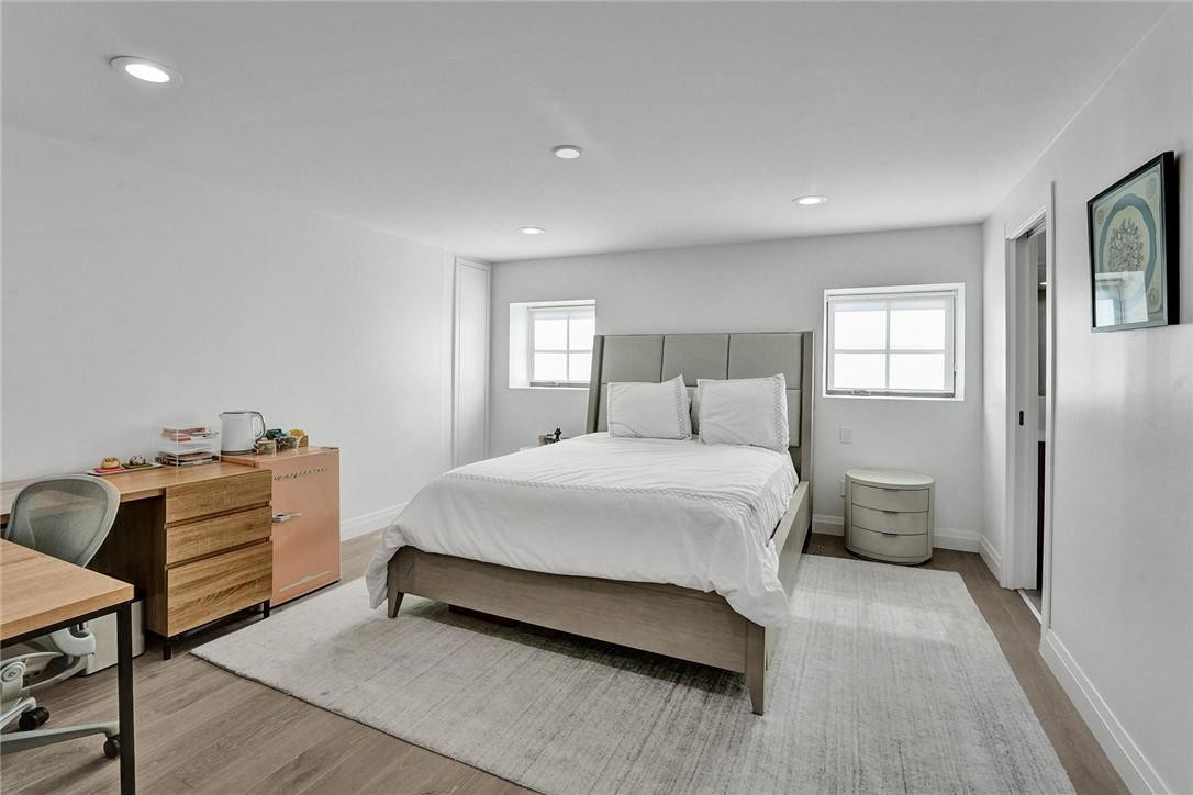 9 Tahoe Lane Sea Ranch Lakes, FL 33308 - Photo 35 of 54 a bedroom with a bed and with furniture